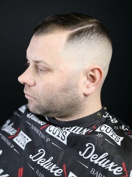 Side part with a high skin fade