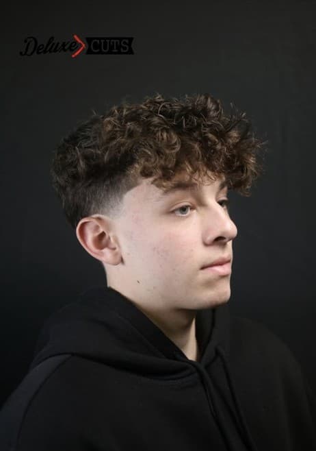 Curly fringe with a low taper