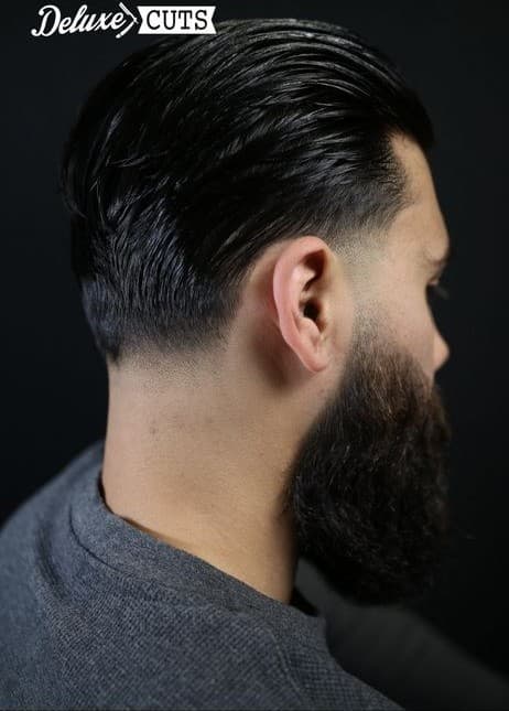 Slicked-back length with a full beard