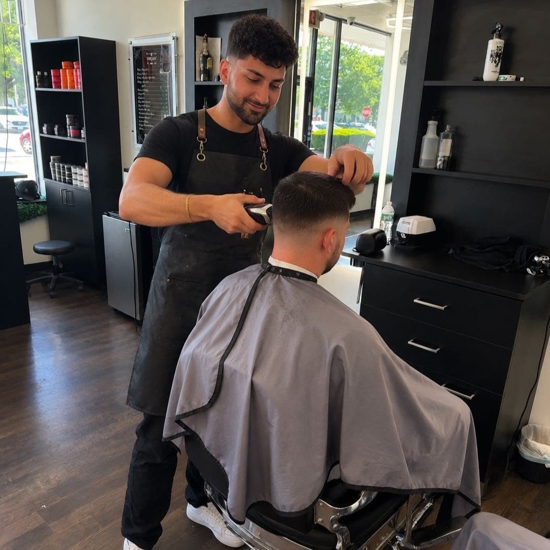 A barber at work by the front window